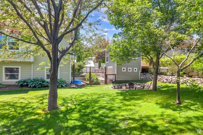Backyard with view of outbuilding. Lower level of the out building can be used for shed storage. | Image 53
