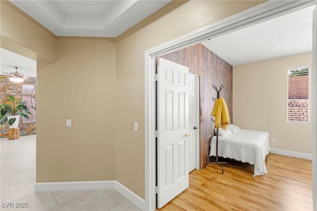 Hallway with baseboards and light wood finished floors | Image 20