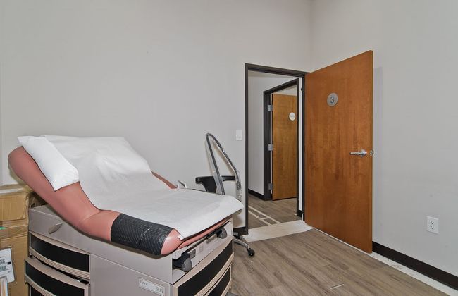 Office area with light wood-style floors and baseboards | Image 19