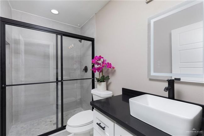 Full bathroom with toilet, vanity, a shower stall, and recessed lighting | Image 10