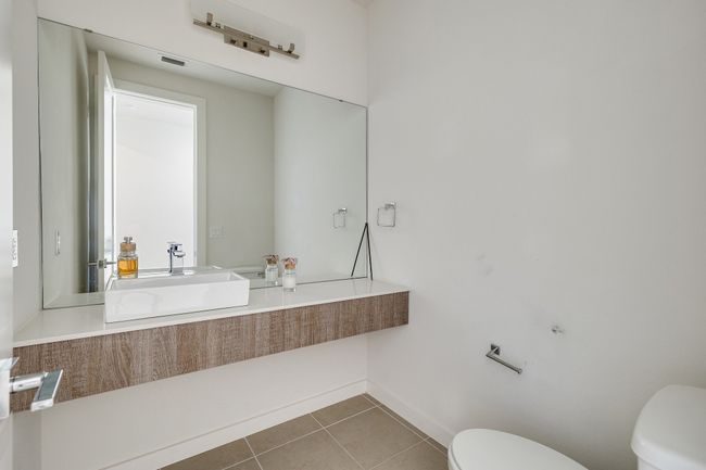 Half bath with toilet and tile patterned floors | Image 35