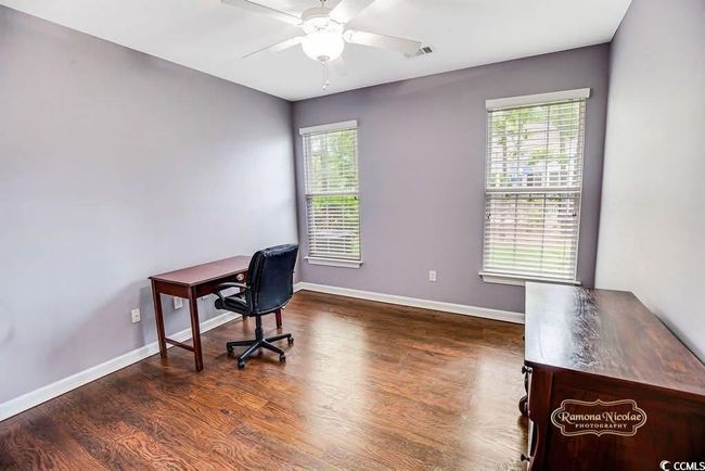BEDROOM #4 OR Office space with plenty of natural light, wood finished floors, and a ceiling fan | Image 21