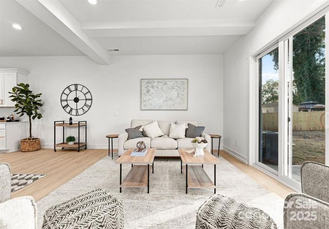 Living room features beams at the living room | Image 12