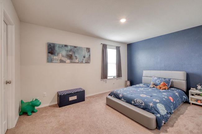 Carpeted bedroom with baseboards | Image 26