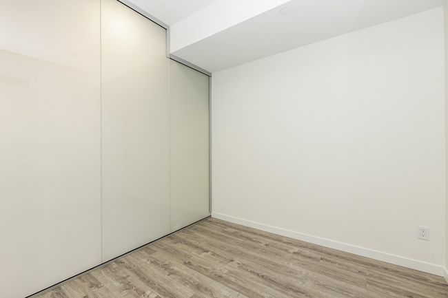 Unfurnished bedroom with light wood-style flooring, a closet, and baseboards | Image 10