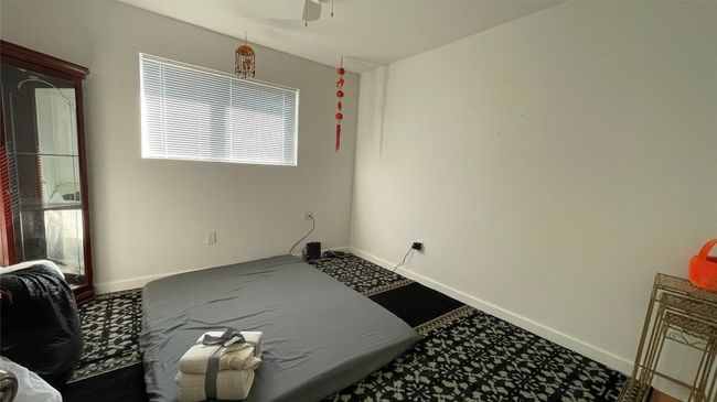 Spare room with ceiling fan and baseboards | Image 11