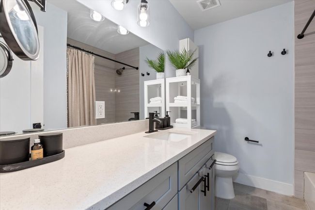 Full bath featuring vanity and toilet | Image 16