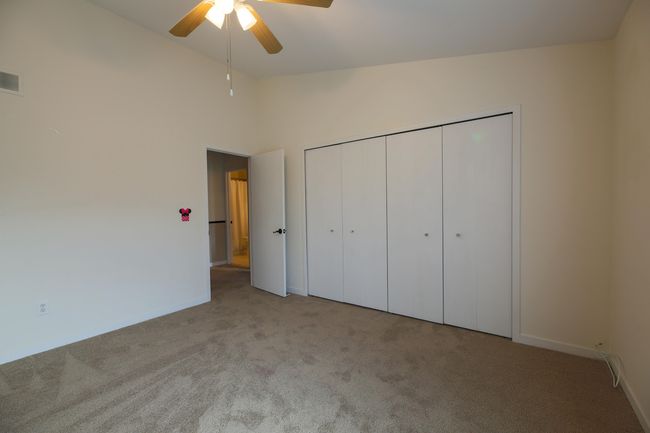 Second Bedroom on the upper floor with high ceilings and large closet. | Image 15