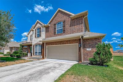 Double garage with extra storage along the side. | Image 3