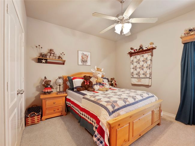 Bedroom featuring carpet floors and ceiling fan | Image 13
