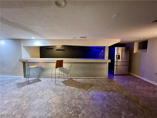 Bar featuring stainless steel fridge | Image 21
