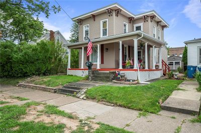 Victorian home featuring covered porch | Image 1