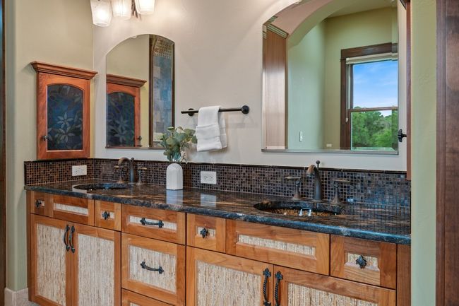 Bathroom with decorative backsplash and double vanity | Image 21
