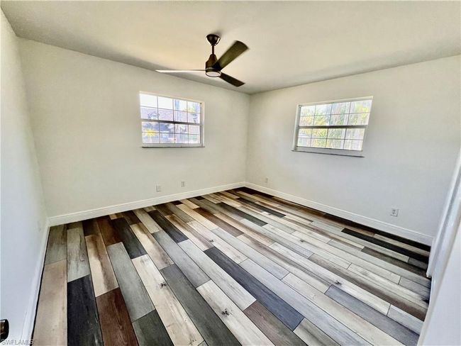 Bedroom featuring LUXURY VINYL PLANK FLOORS. | Image 25