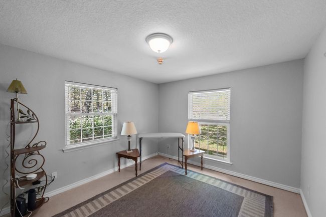 Home office with a wealth of natural light, baseboards, and a textured ceiling | Image 25