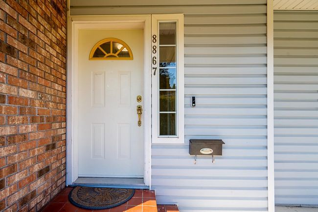 Doorway to property featuring covered porch | Image 30