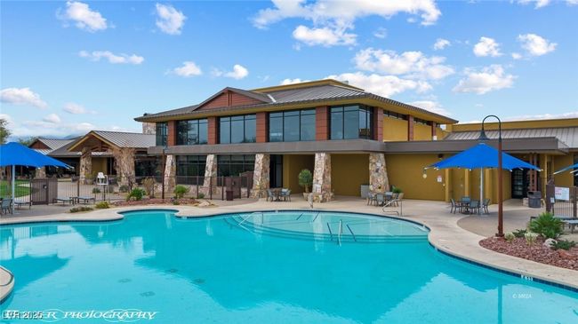 Pool featuring a patio area and fence | Image 74