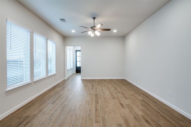 Unfurnished room featuring ceiling fan and light hardwood / wood-style floors | Image 7