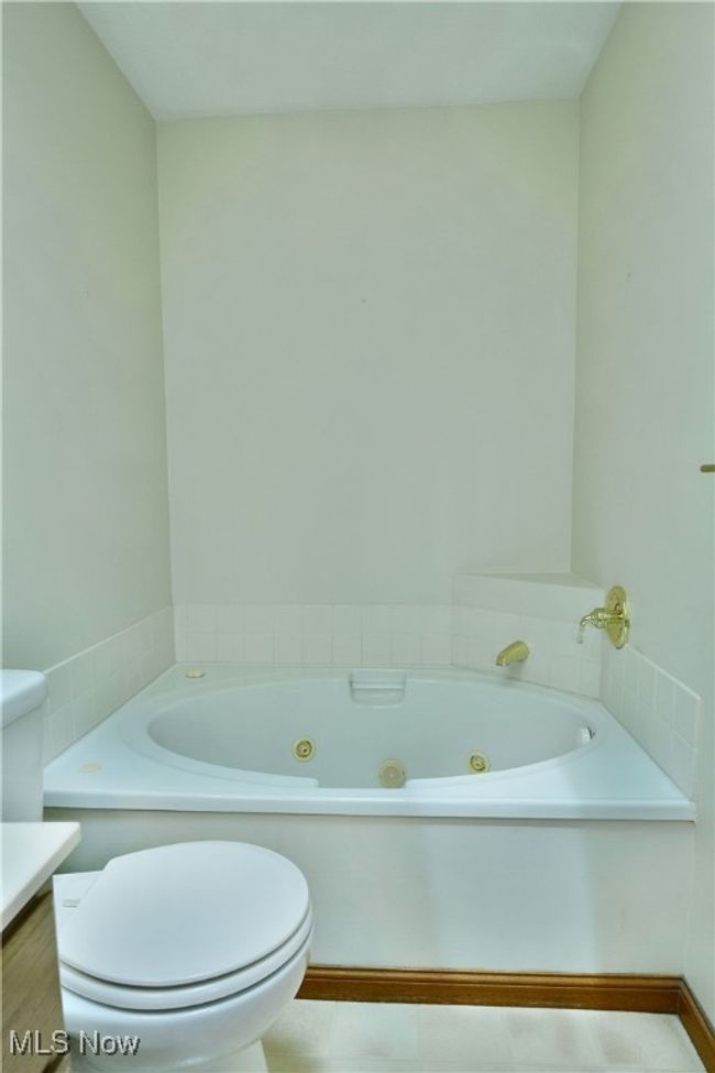 Full bath with a whirlpool tub and vanity | Image 43