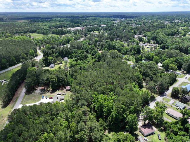 Aerial view featuring a forest view | Image 7