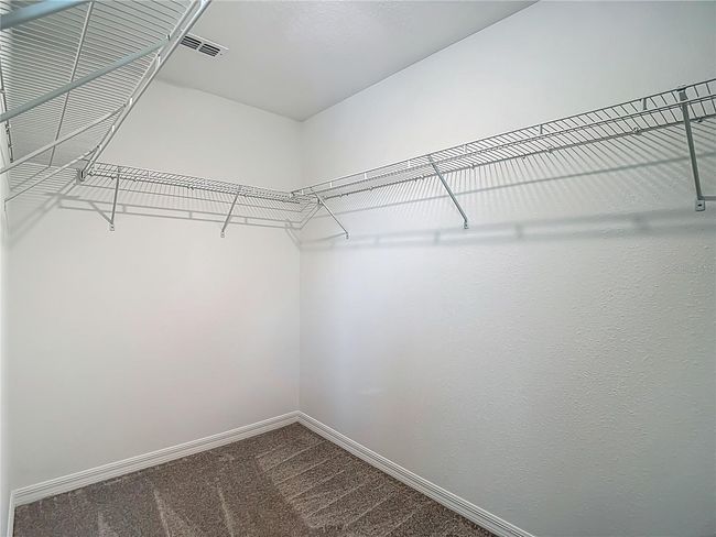 Primary Bedroom's Expansive Walk-In Closet | Image 39