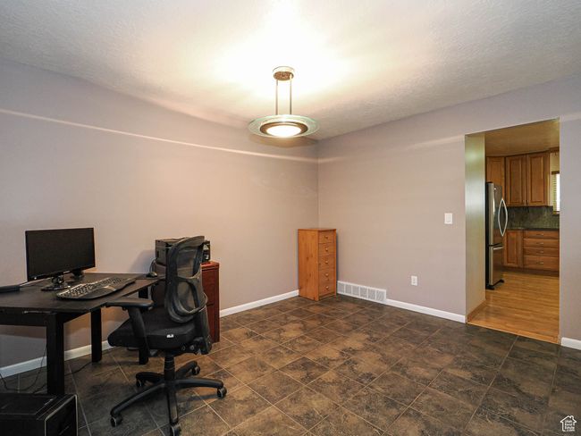 Office featuring baseboards and a textured ceiling | Image 18