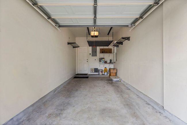 Great storage in Garage - overhead racks and wall shelf storage. | Image 29