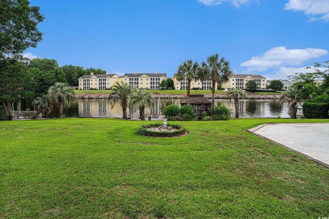 View of grassy yard with a water view and a residential view | Image 38