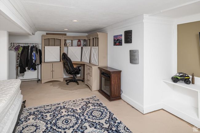 Office space with ornamental molding and built in desk | Image 36