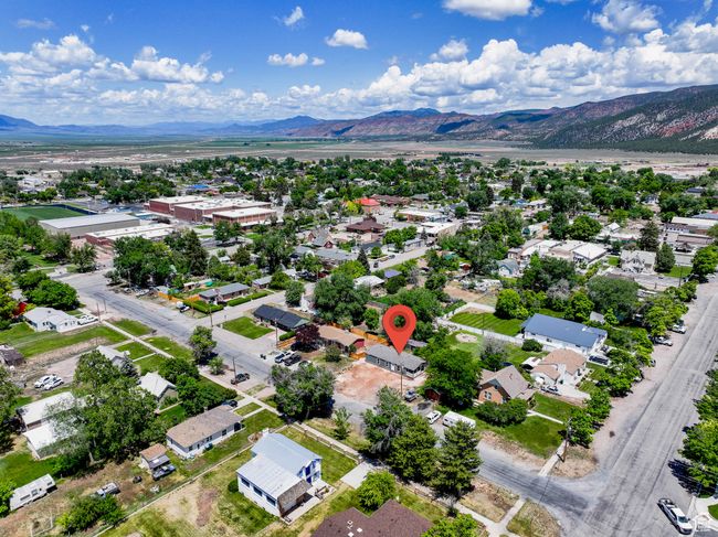 Aerial perspective of suburban area featuring a mountain backdrop | Image 25