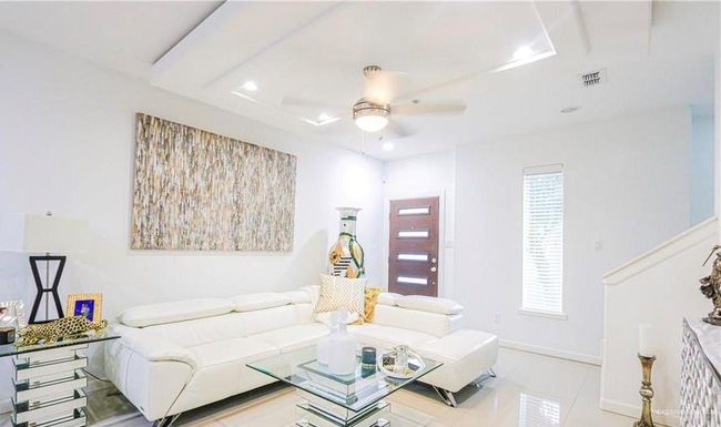 Tiled living room featuring ceiling fan | Image 5