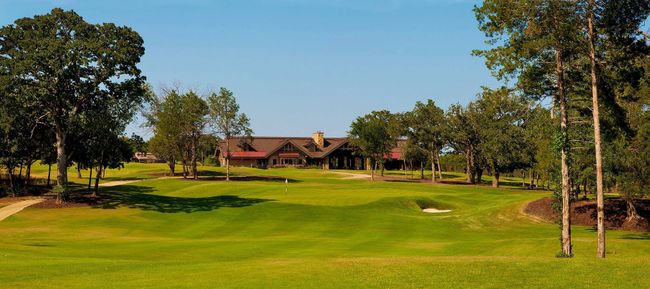 View of property's community featuring a lawn and view of golf course | Image 5