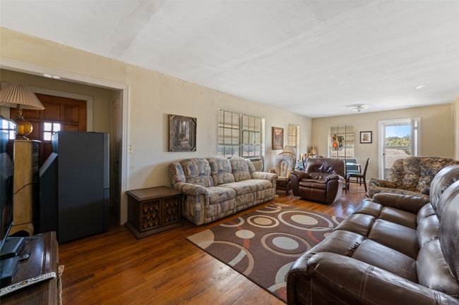 Living room with dark wood-style floors | Image 4