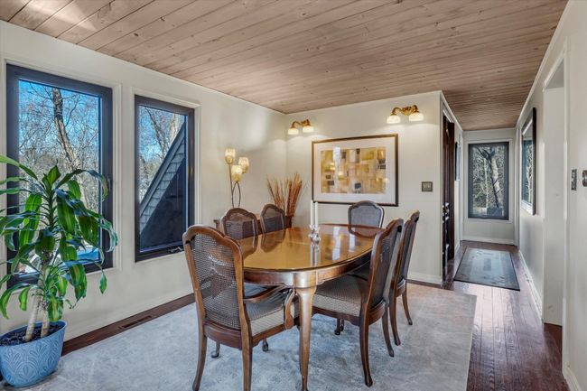 Dining room featuring wood ceiling and light wood-type flooring | Image 9