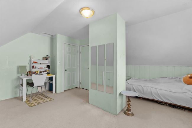 Bedroom featuring carpet floors and vaulted ceiling | Image 19