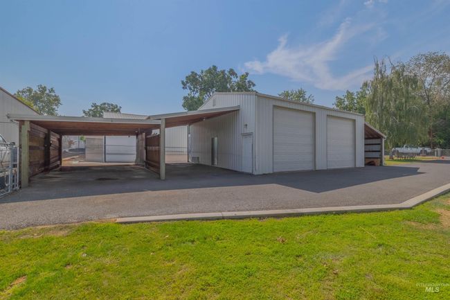 Garage featuring a garage | Image 5