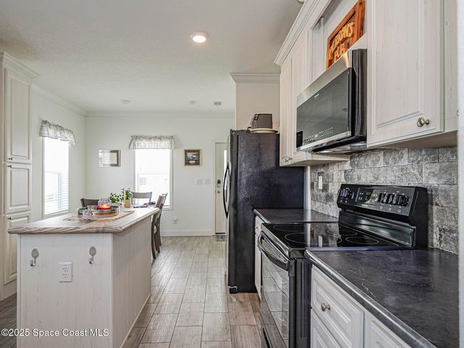 623 Hyacinth Cir, House other with 3 bedrooms, 2 bathrooms and null parking in Barefoot Bay FL | Image 17