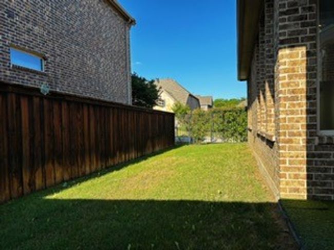 View of fenced backyard | Image 20