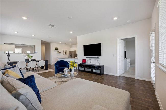 Living area with wood finished floors and recessed lighting | Image 17