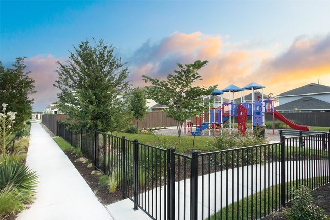 Playground at dusk featuring fence and playground community | Image 4