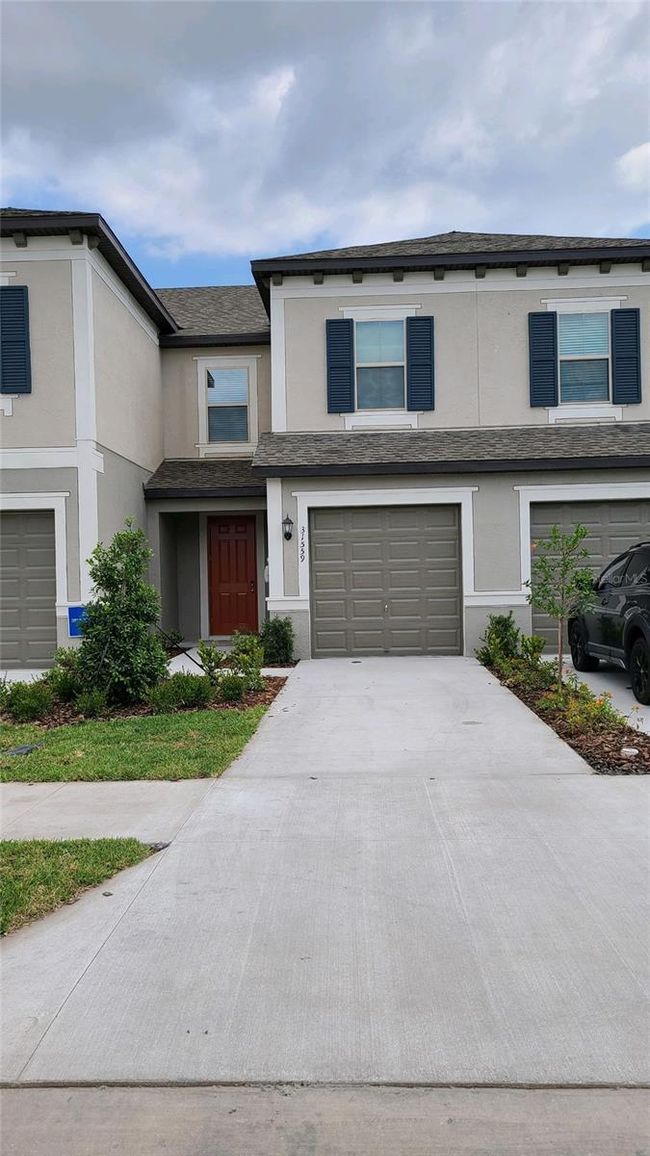 31559 Blue Passing Loop, Townhouse with 3 bedrooms, 2 bathrooms and null parking in Wesley Chapel FL | Image 2