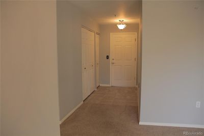 The entryway is in the unit and has lots of closet space. | Image 3