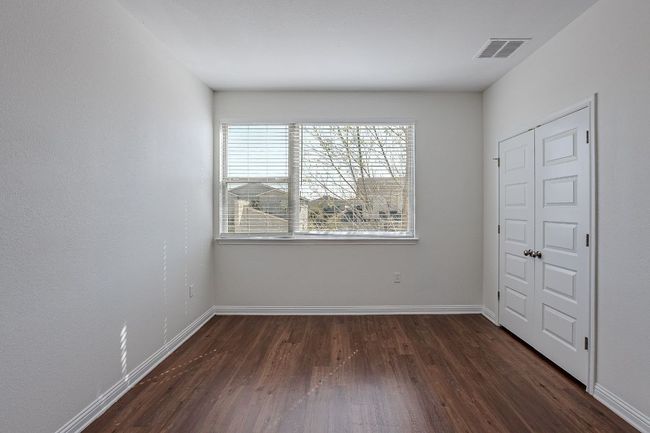 Unfurnished bedroom featuring baseboards, visible vents, and wood finished floors | Image 20