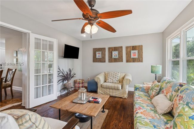 Second living room with plenty of lounging areas, gorgeous open windows allow for plenty of natural light if desired, hardwood floors. | Image 41