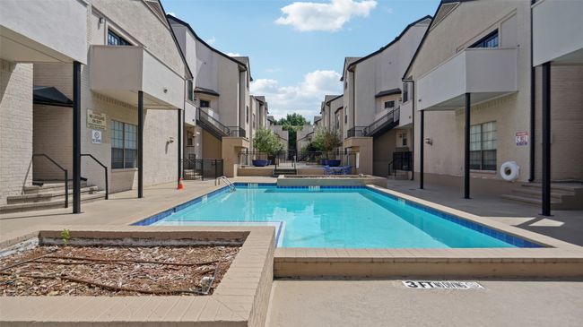 Community pool with a residential view | Image 32