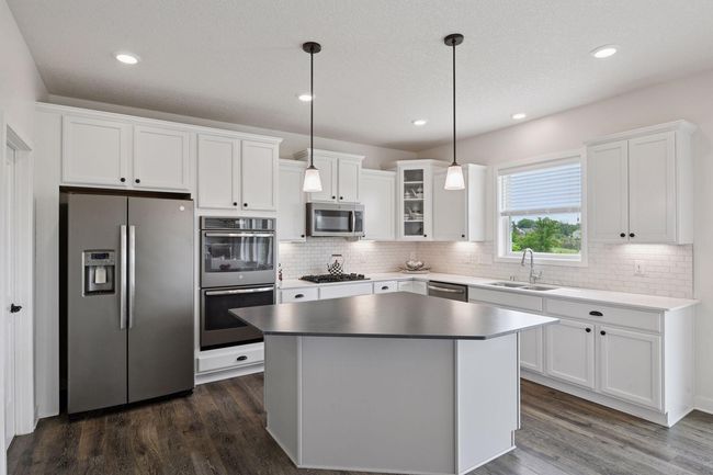 Beautiful kitchen with stainless steel appliances and a large island, perfect for entertaining | Image 13