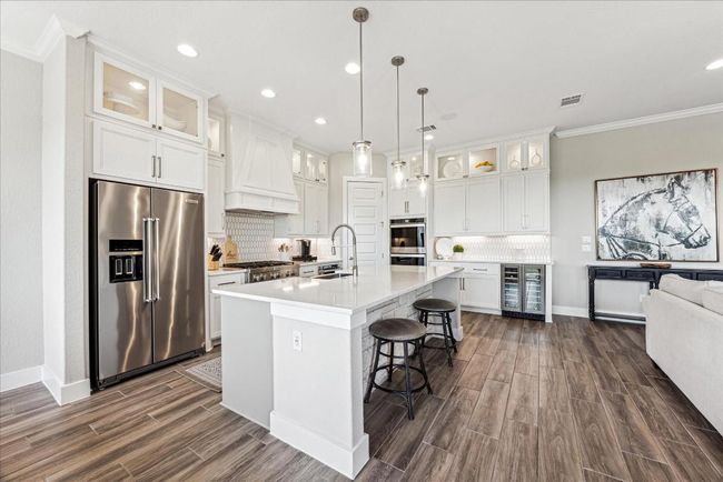 CHEERS to the wine fridge in the last cabinet, standing proudly between the kitchen and living area, always ready to chill and delight! | Image 11