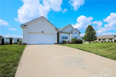 View of front of house with a front yard and a garage | Image 2