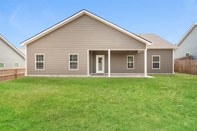 Image is of the same floor plan as 1012 Echo Ridge Rd, but this is a different home in the neighborhood. Shown as an example of the back of home and covered patio. | Image 15