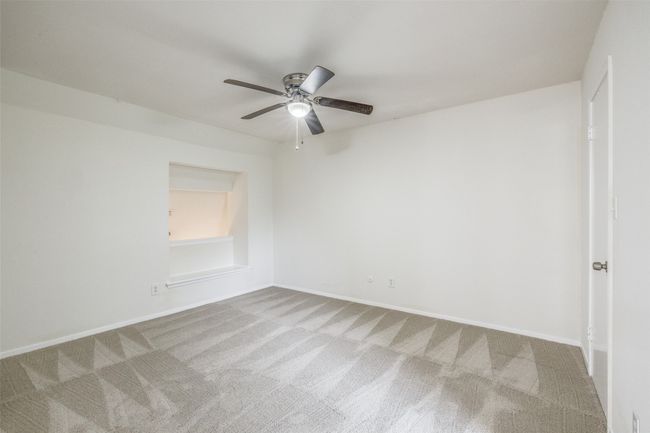 Unfurnished room with carpet floors and a ceiling fan | Image 18